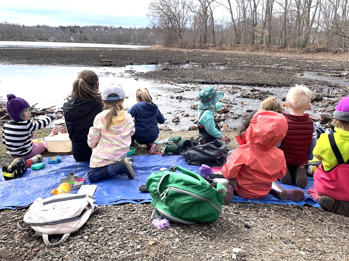 LexFarm education children sitting at water's edge